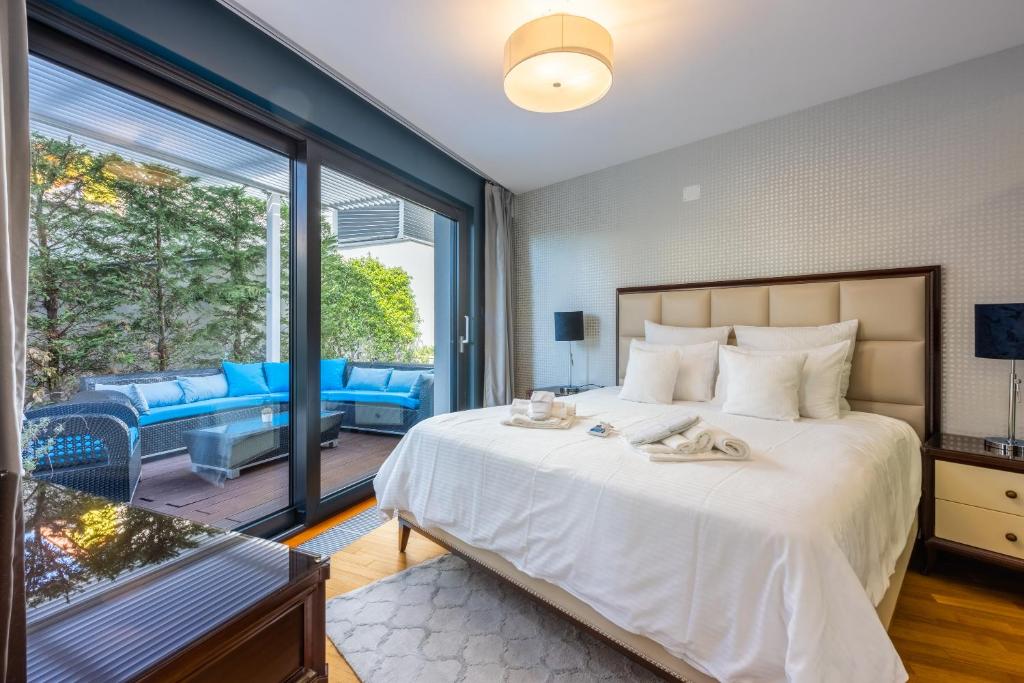 Posteľ alebo postele v izbe v ubytovaní VILLA PANORAMICA