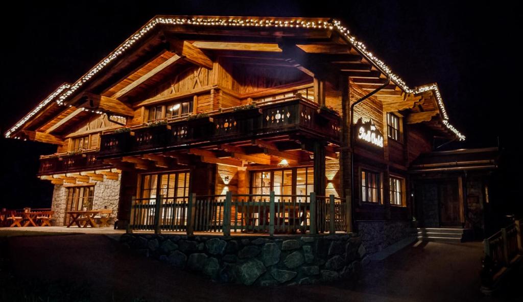 a log house at night with lights on it at Stadl Chalet Ischgl in Ischgl
