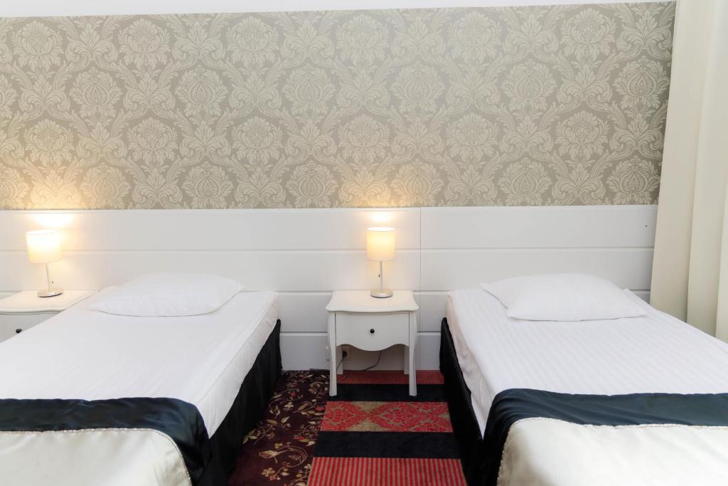 Postel nebo postele na pokoji v ubytování Hotel Lamberton