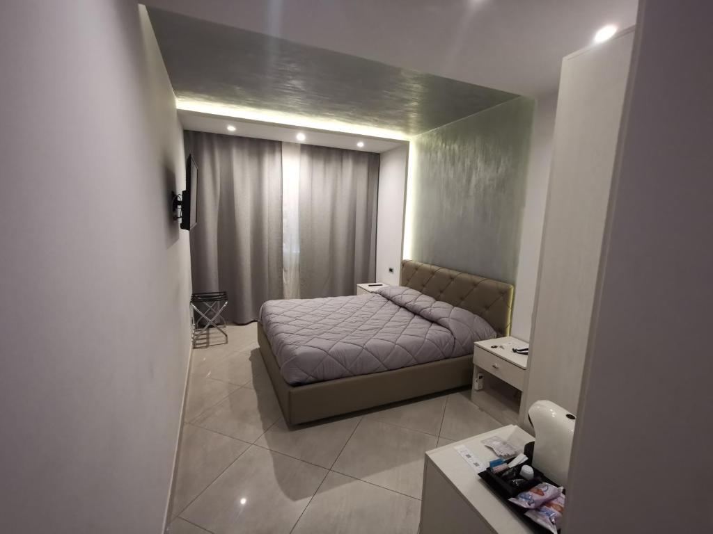 Postel nebo postele na pokoji v ubytování B&B Rossini Luxury