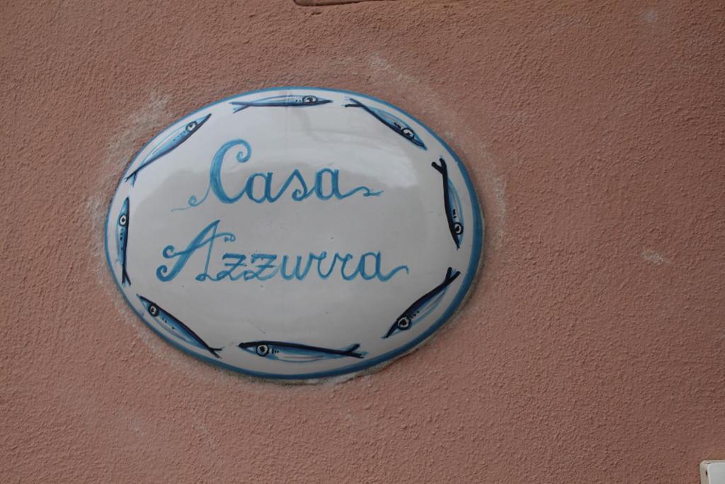 a blue and white plate on a wall at Casa Azzurra in Cetara