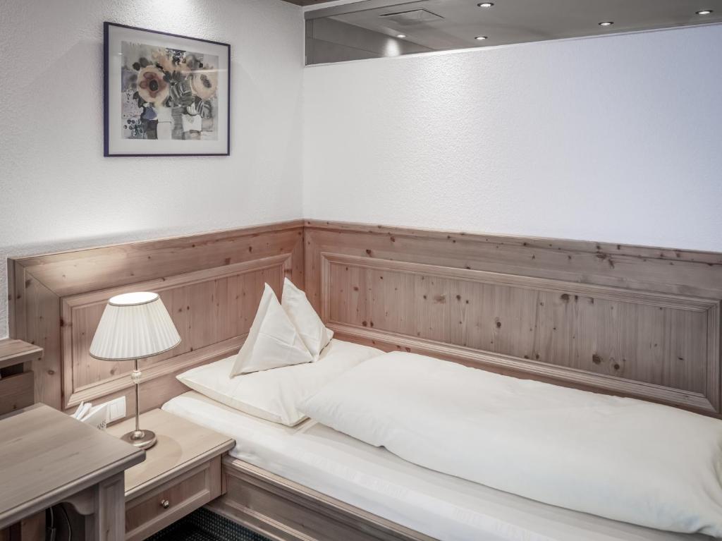 Postel nebo postele na pokoji v ubytování Hotel Alpenland