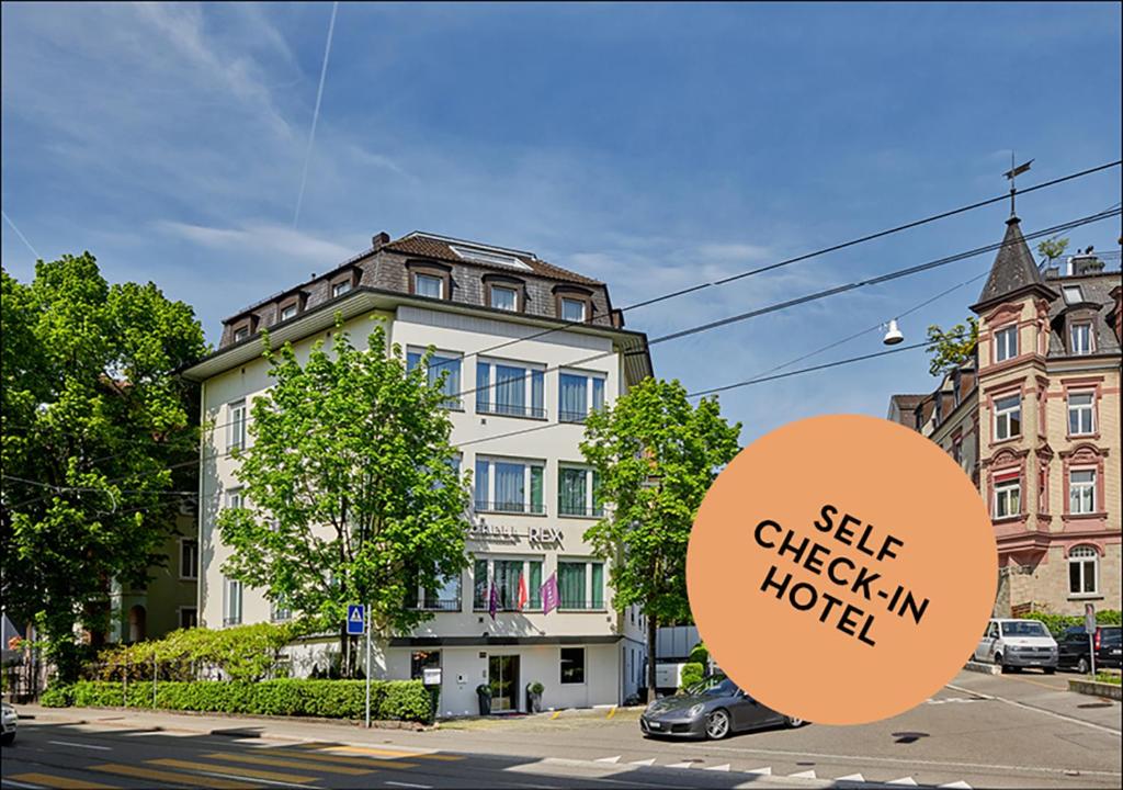 a building with a sign that reads sell chicken hotel at Sorell Hotel Rex in Zurich