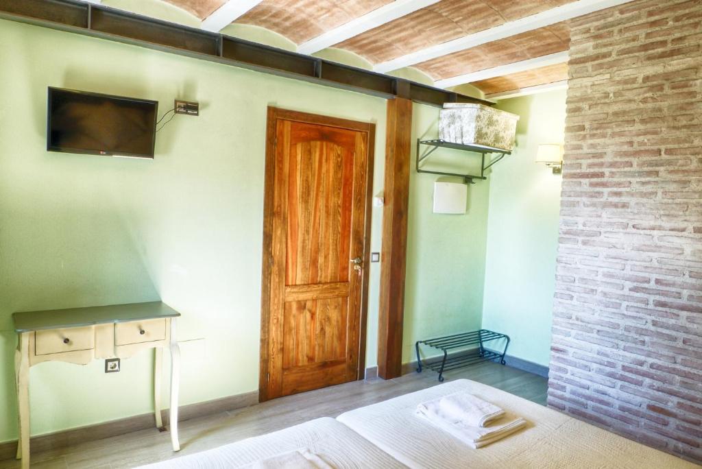 TV a/nebo společenská místnost v ubytování Casa rural El Roble Hueco