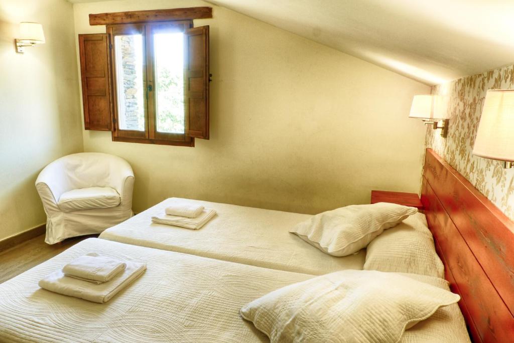 Postel nebo postele na pokoji v ubytování Casa rural El Roble Hueco