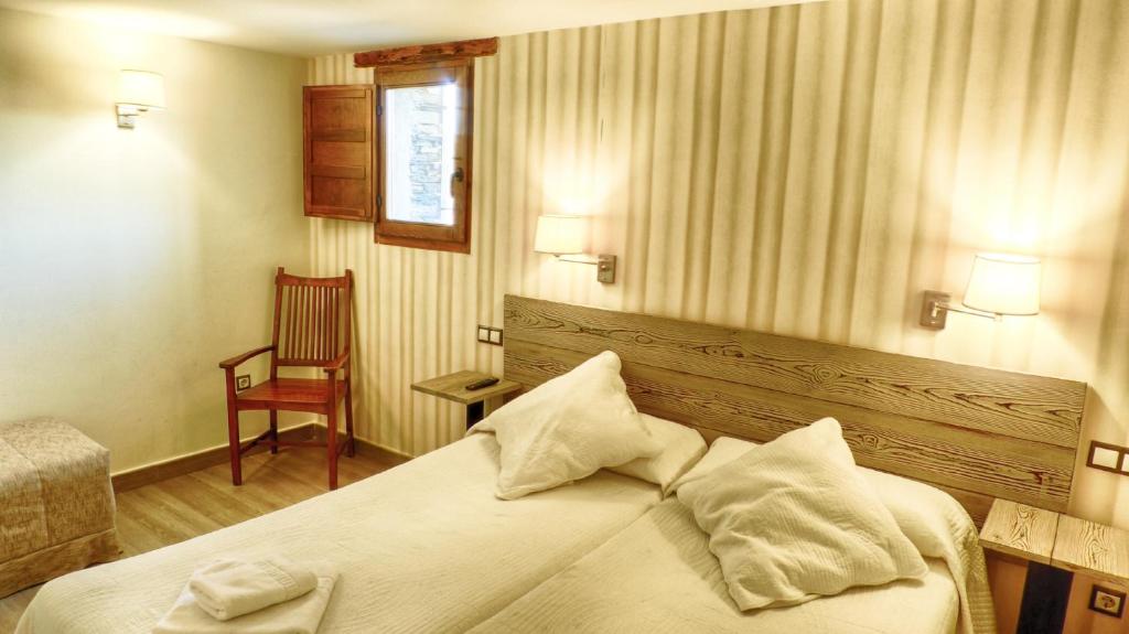 Postel nebo postele na pokoji v ubytování Casa rural El Roble Hueco