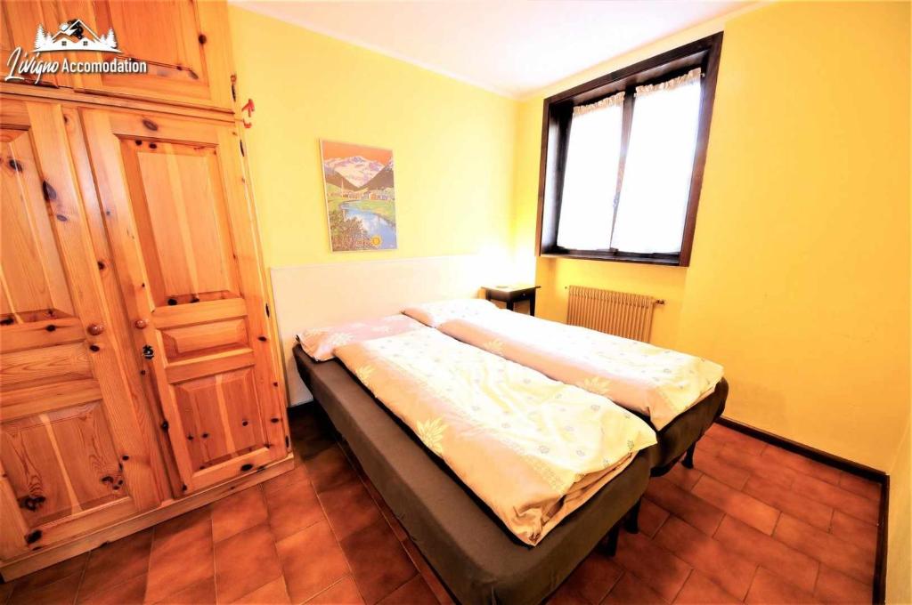 Posteľ alebo postele v izbe v ubytovaní Baite Costaccia App 4 by Livigno Accomodation
