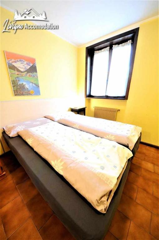 Posteľ alebo postele v izbe v ubytovaní Baite Costaccia App 4 by Livigno Accomodation