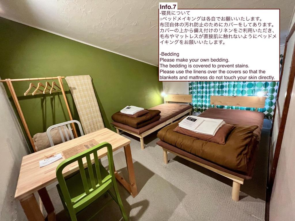 Postel nebo postele na pokoji v ubytování Shared house TATEMACHI in Gujo Hachiman