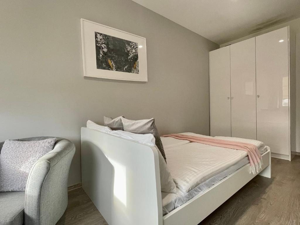 Posteľ alebo postele v izbe v ubytovaní Nowoczesny Apartament z widokiem na rzekę i jezioro