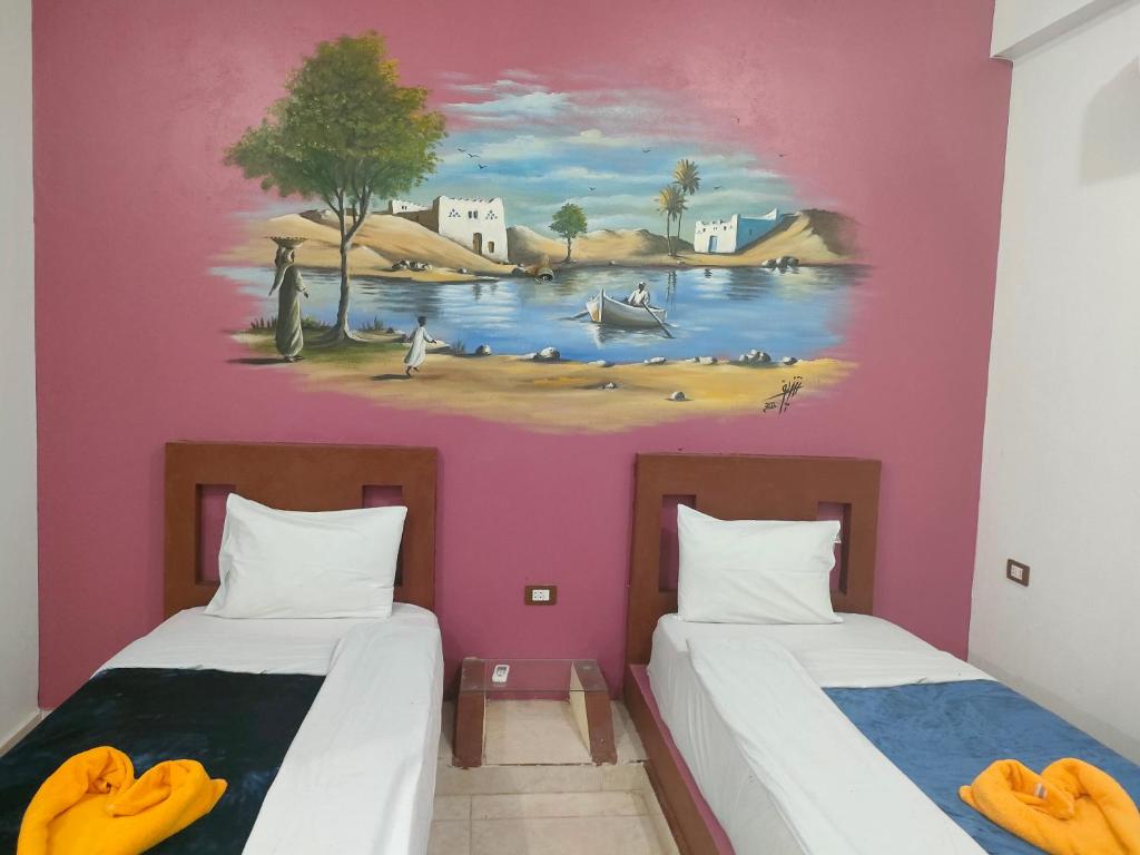Postel nebo postele na pokoji v ubytování Nukud guest house