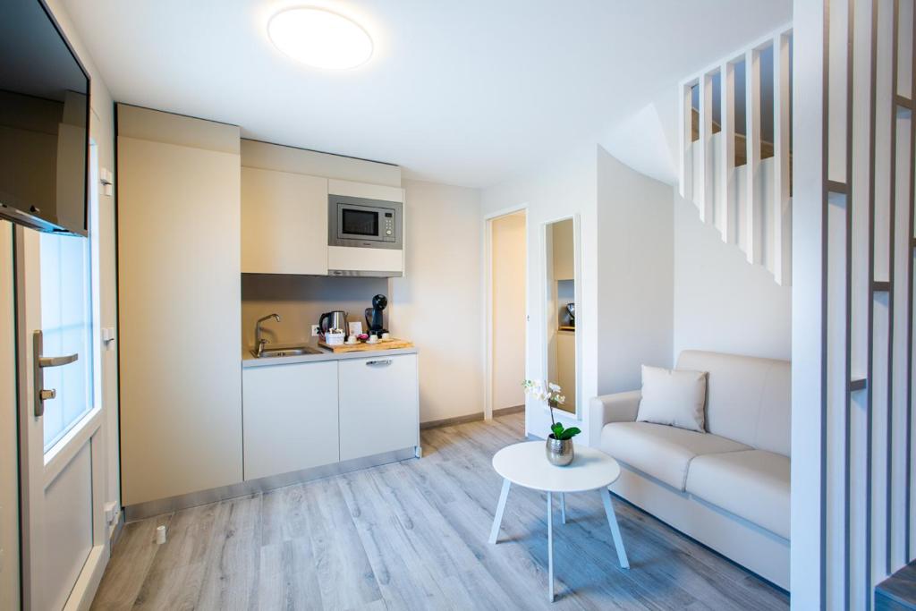 Kuchyň nebo kuchyňský kout v ubytování Auberge des Grands Bois