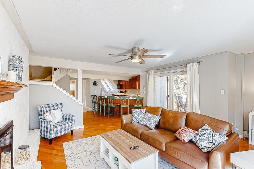 a living room with a couch and a table at Kingswood Mountainside Retreat in White River Junction