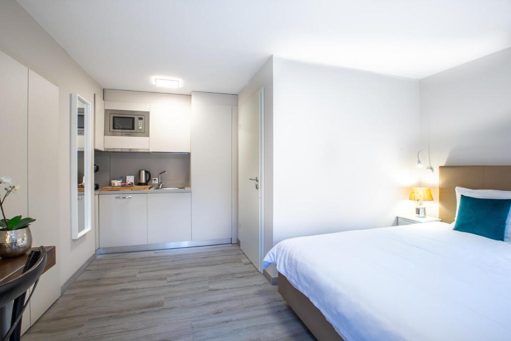 Postel nebo postele na pokoji v ubytování Auberge des Grands Bois