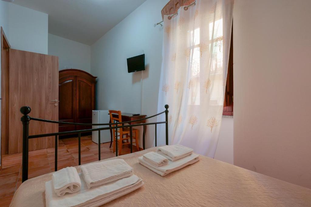 Postel nebo postele na pokoji v ubytování La Scala del Sale
