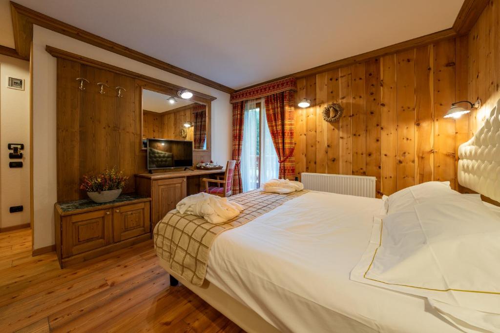 Postel nebo postele na pokoji v ubytování Lo Scoiattolo Hotel