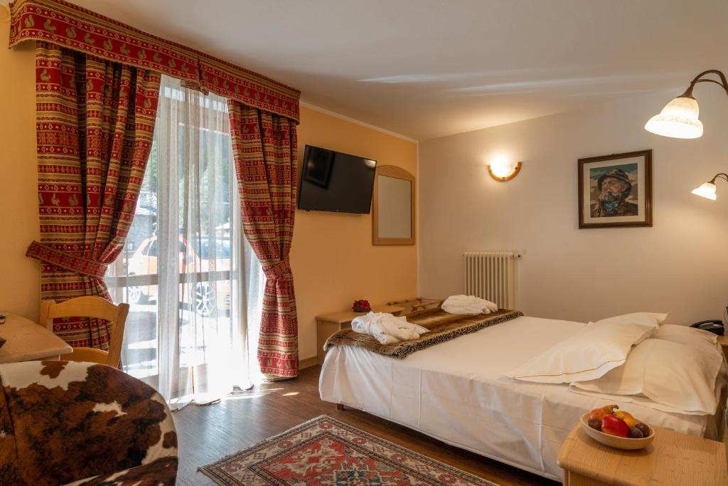 Postel nebo postele na pokoji v ubytování Lo Scoiattolo Hotel
