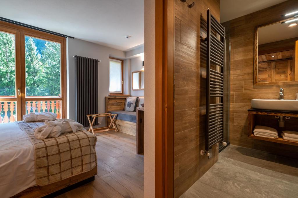 Postel nebo postele na pokoji v ubytování Lo Scoiattolo Hotel