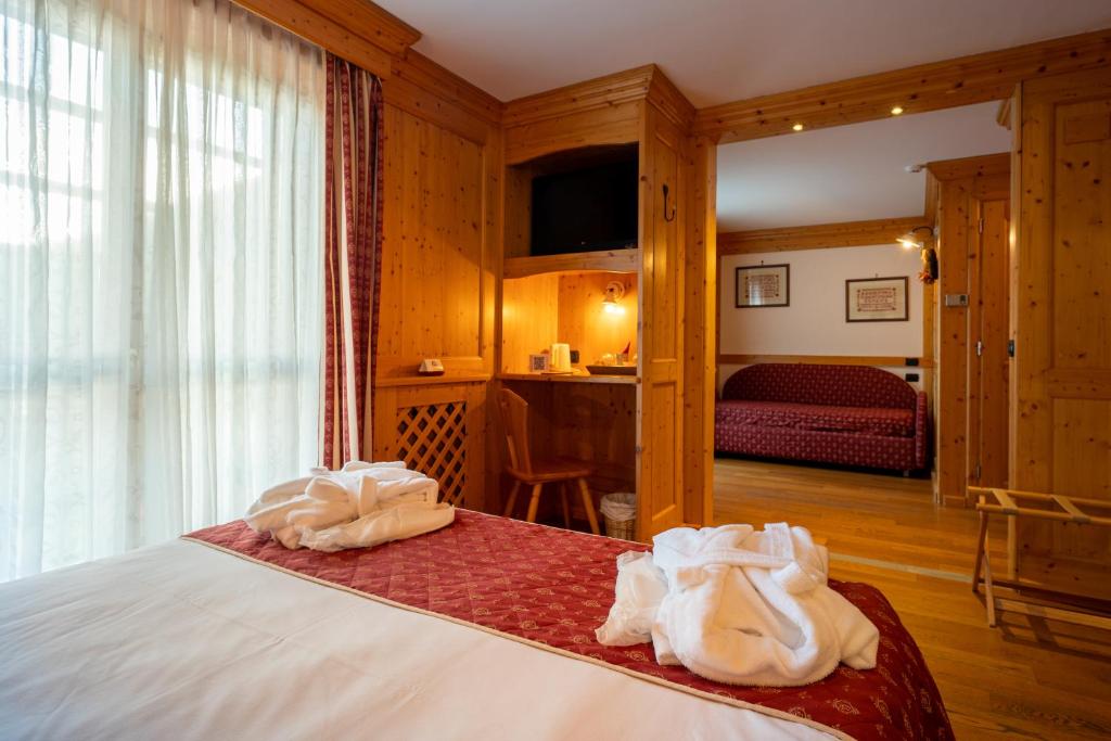 Postel nebo postele na pokoji v ubytování Lo Scoiattolo Hotel
