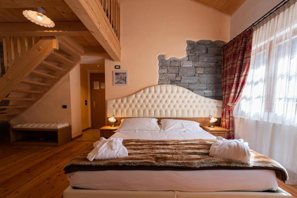 Postel nebo postele na pokoji v ubytování Lo Scoiattolo Hotel