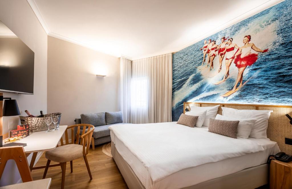 Postel nebo postele na pokoji v ubytování Prima Music Hotel
