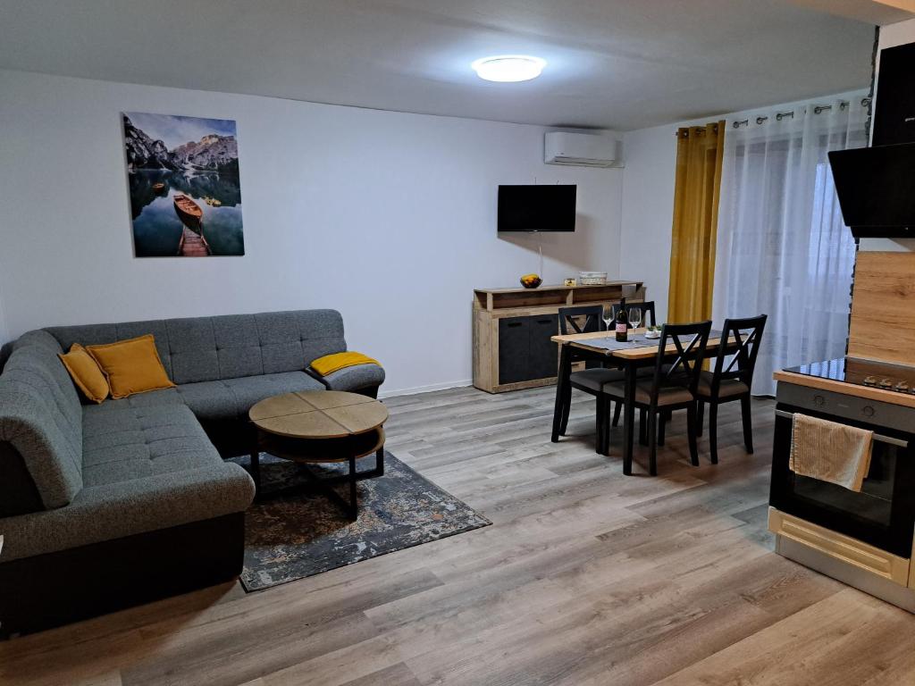 a living room with a couch and a table at Apartman Stefany in Varaždin