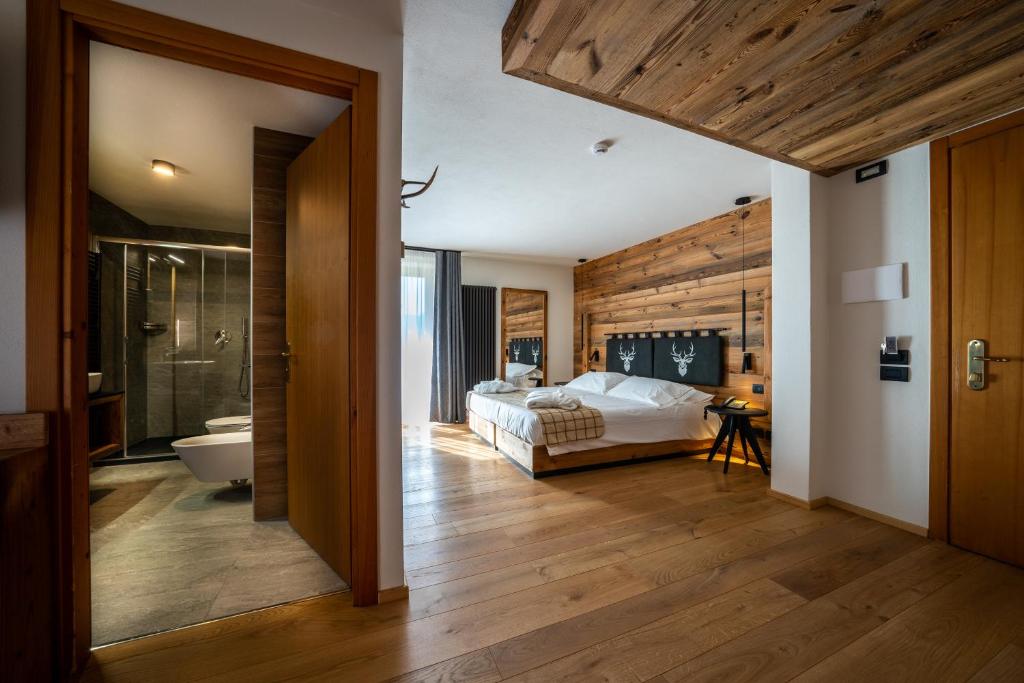 Postel nebo postele na pokoji v ubytování Lo Scoiattolo Hotel