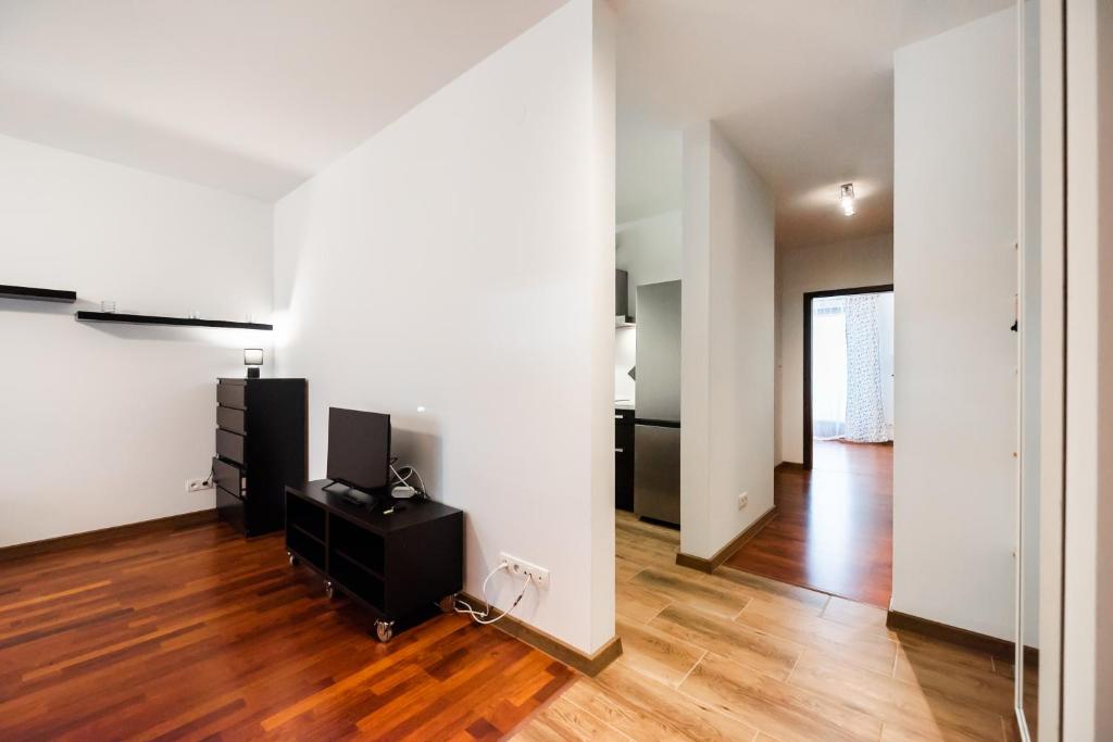 Televízia a/alebo spoločenská miestnosť v ubytovaní Malborska Lovely Apartment