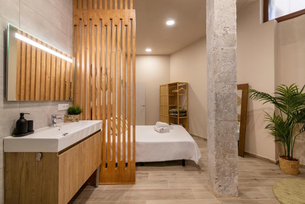 Ένα ή περισσότερα κρεβάτια σε δωμάτιο στο Art Lofts Gardens