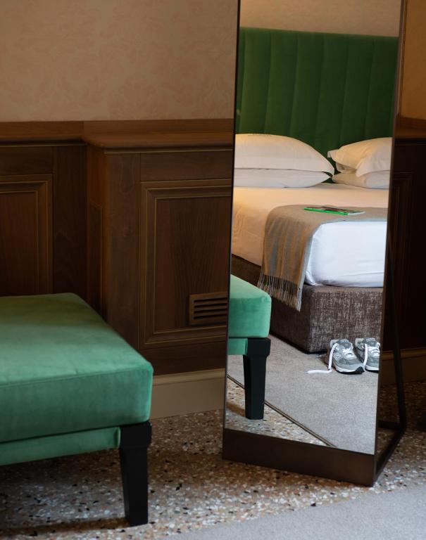 Postel nebo postele na pokoji v ubytování Eight Venezia