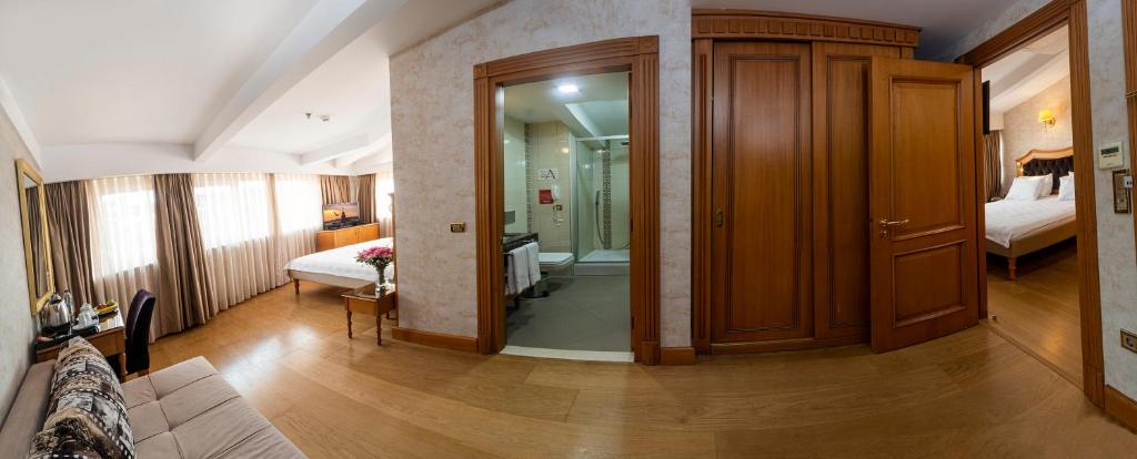 A bed or beds in a room at Aprilis Hotel - Special Category