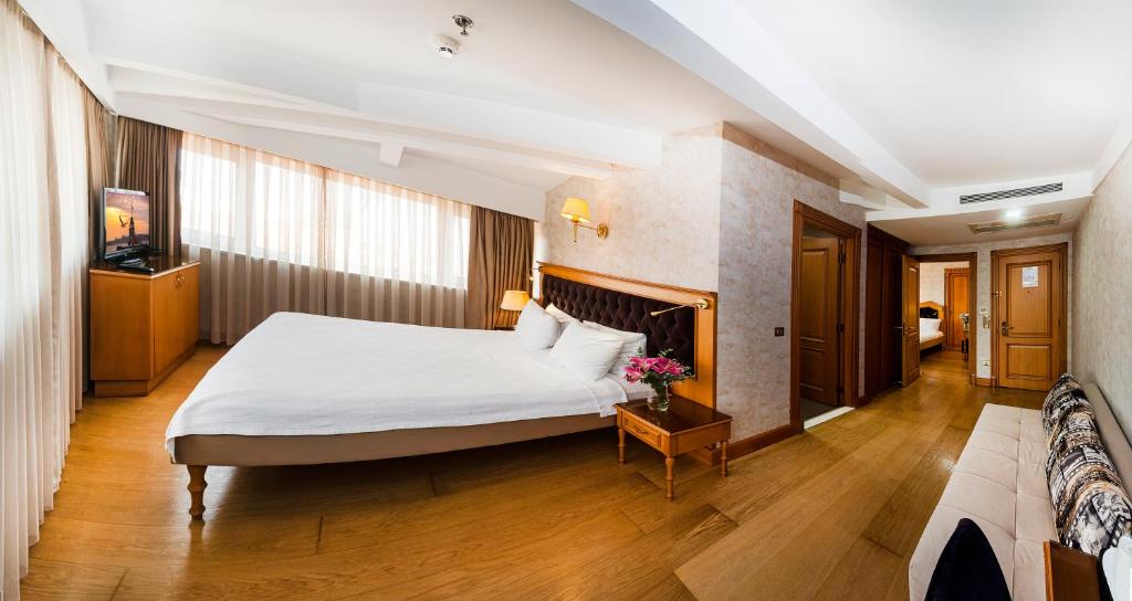A bed or beds in a room at Aprilis Hotel - Special Category