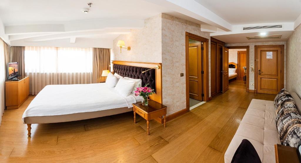 A bed or beds in a room at Aprilis Hotel - Special Category