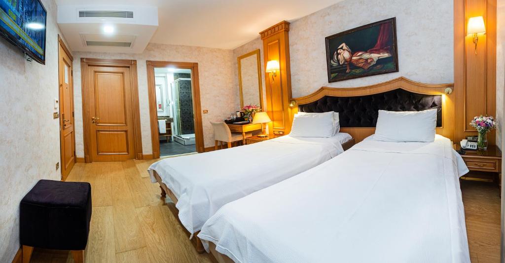 A bed or beds in a room at Aprilis Hotel - Special Category