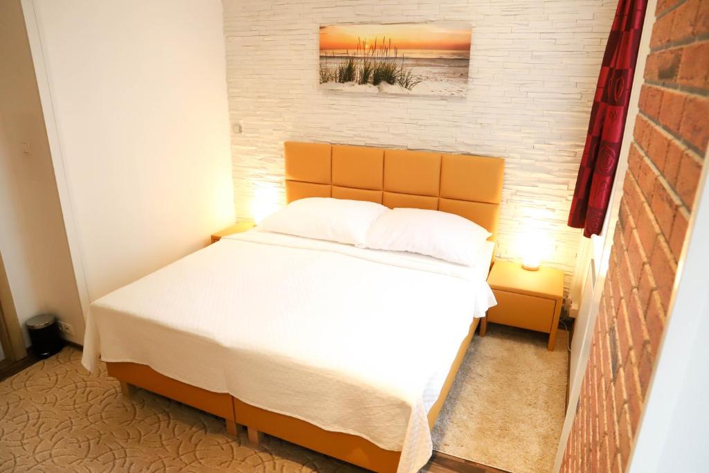 Posteľ alebo postele v izbe v ubytovaní «Go West» guest rooms