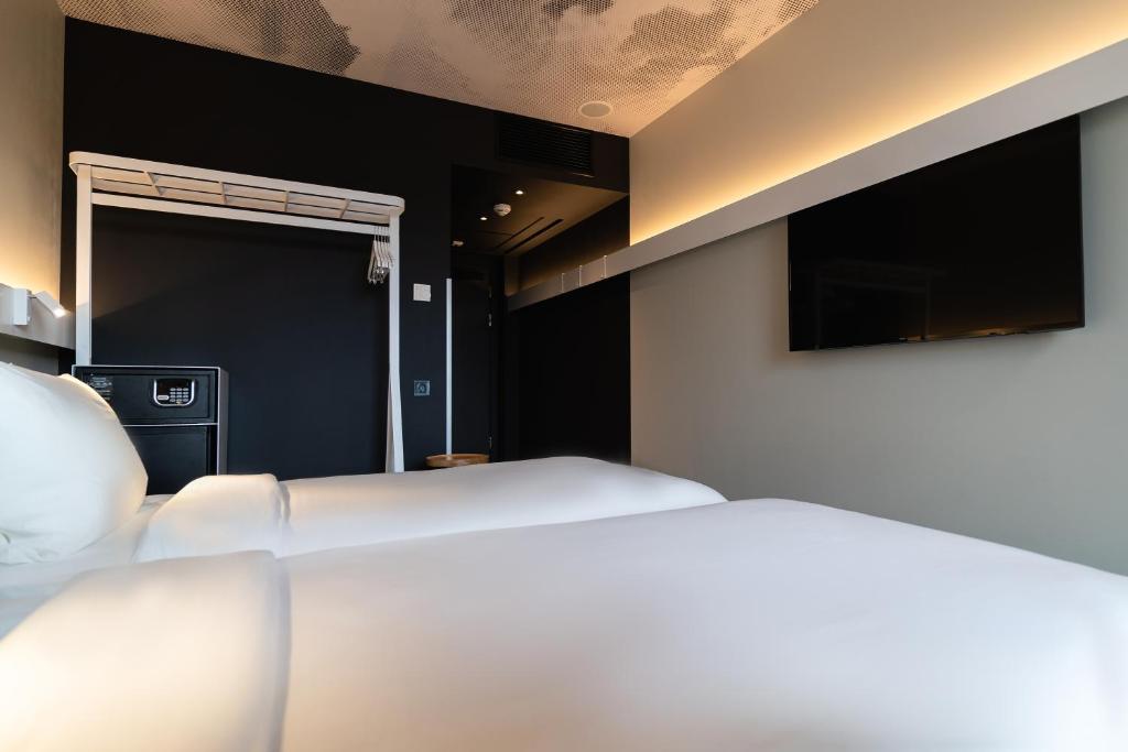 Postel nebo postele na pokoji v ubytování ibis Lviv Center