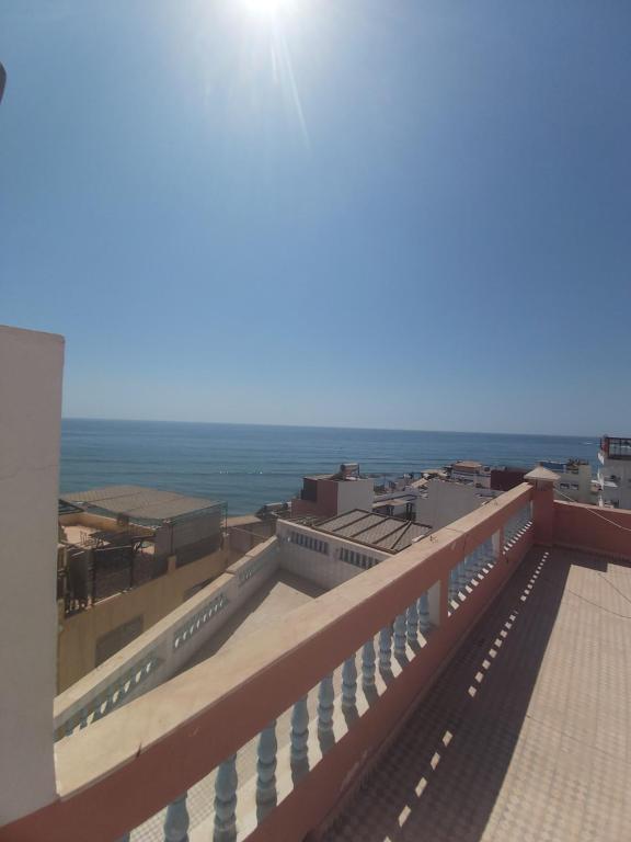 a view of the ocean from the roof of a building at Résidence Taghazout Oufella by Surf Times in Taghazout