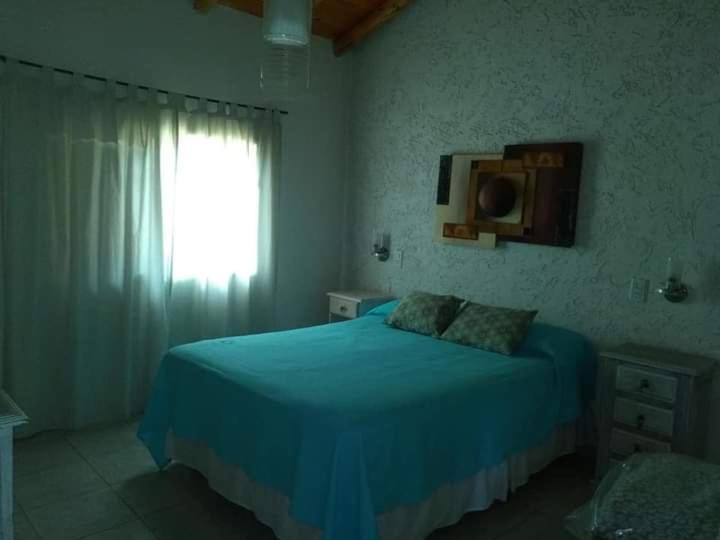מיטה או מיטות בחדר ב-Cabañas Paraje Noviembre