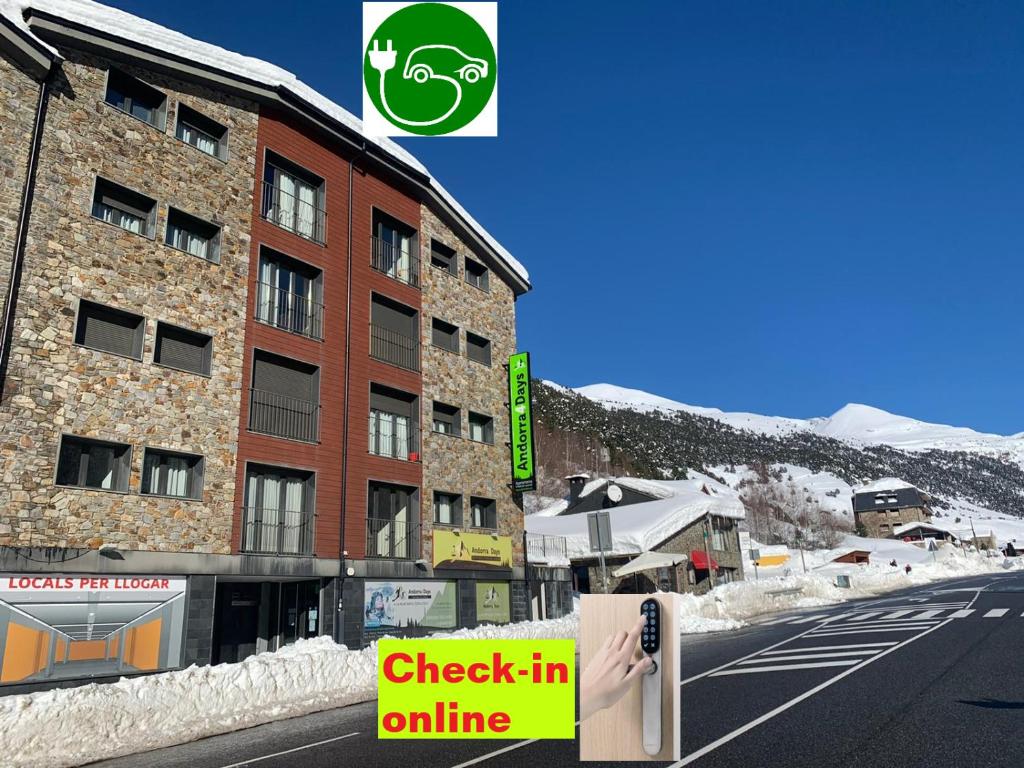 a building with a sign on the side of a street at Andorra4days Soldeu - El Tarter in Soldeu