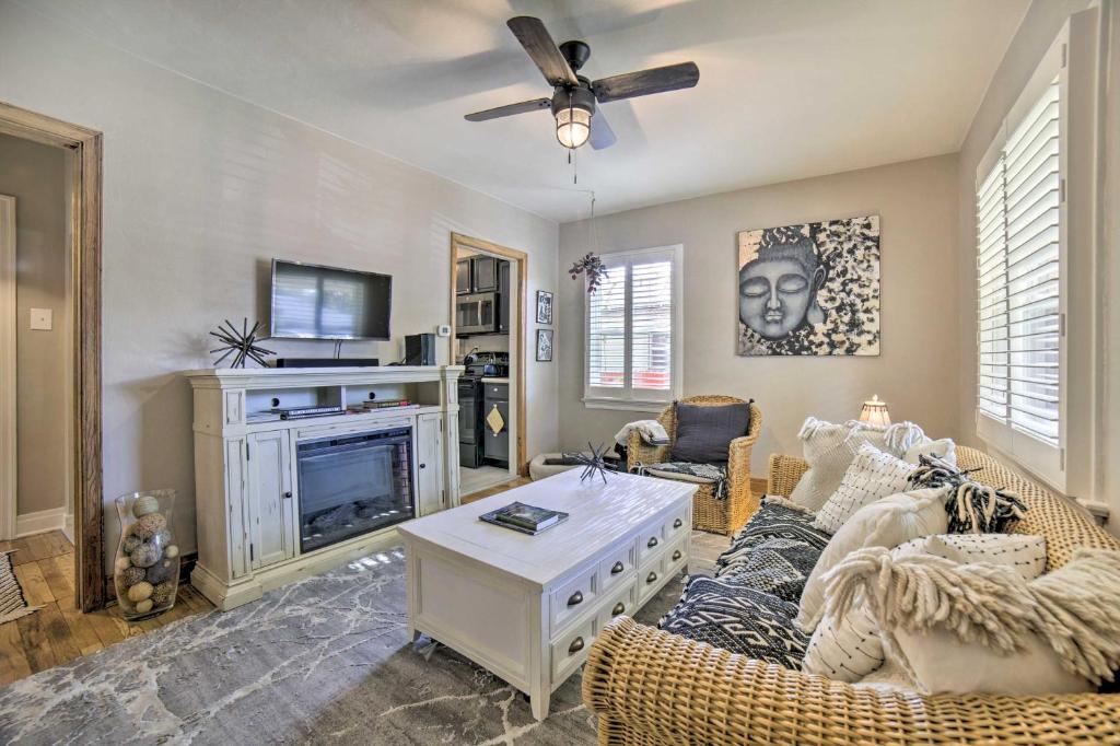 a living room with a couch and a fireplace at Enchanting Reno Retreat with Deck Walk to Midtown! in Reno