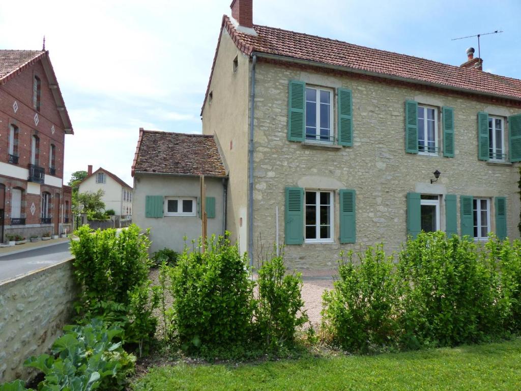 an old stone house with green shutters on a street at Charmante maison rénovée avec jardin clos, 3 chambres, proche sites touristiques et villlage médiéval - FR-1-489-105 in Saint-Bonnet-de-Rochefort