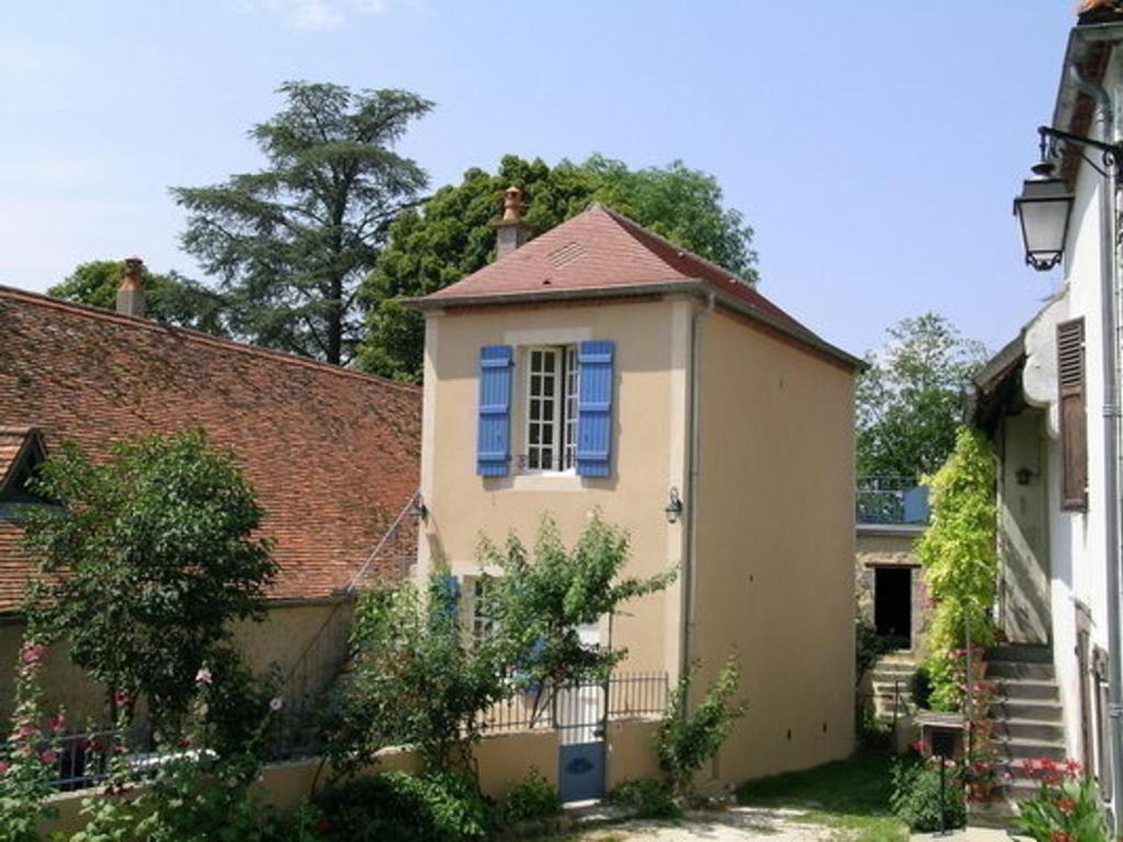 a small house with blue windows and a roof at Gîte Billy, 3 pièces, 4 personnes - FR-1-489-164 in Billy