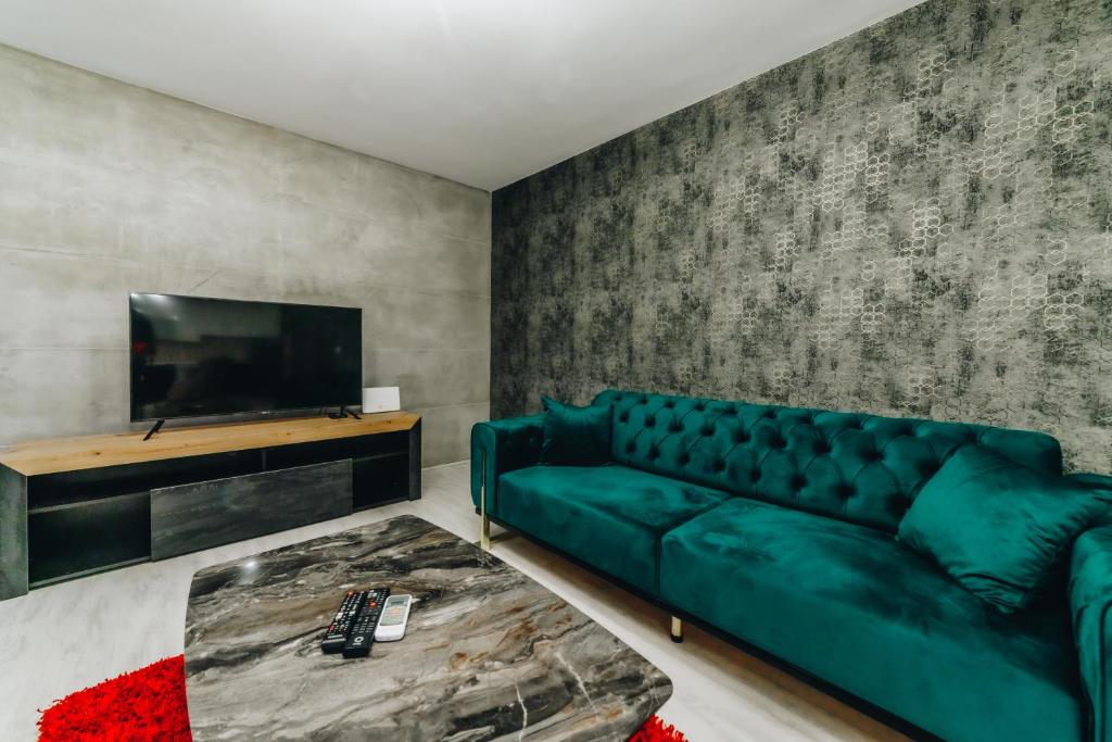 TV a/nebo společenská místnost v ubytování Garni Hotel Radović