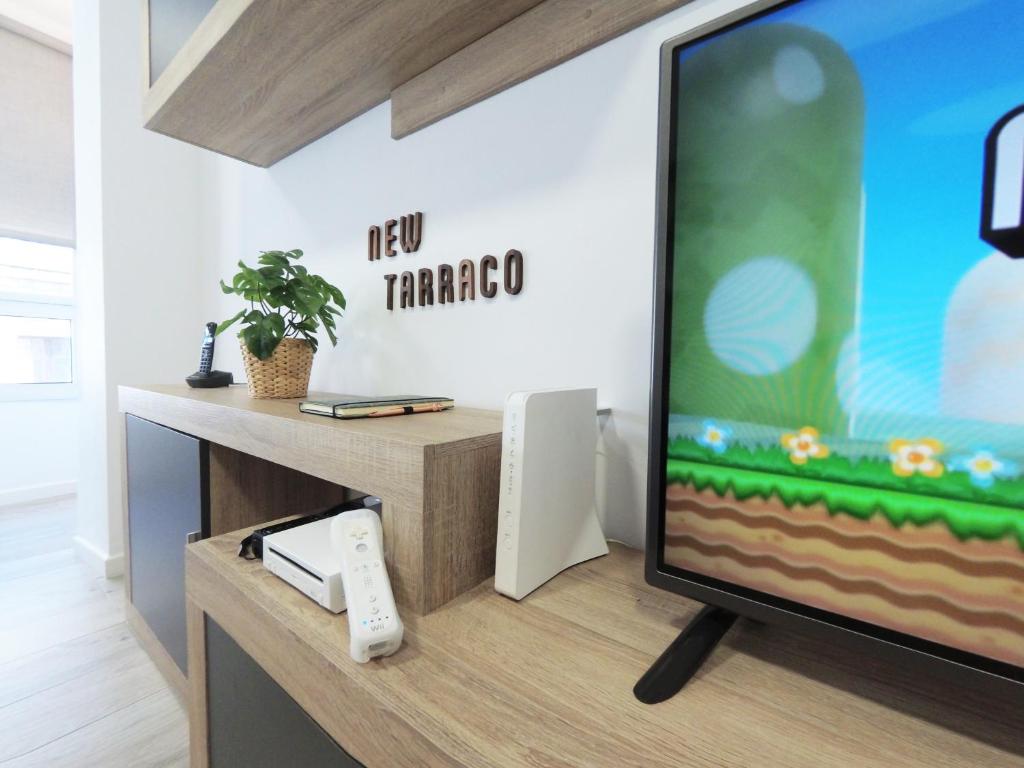 TV a/nebo společenská místnost v ubytování Apartamento New Tarraco