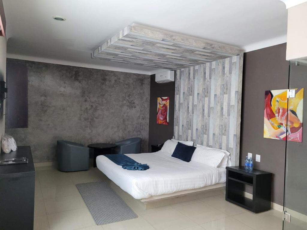 Postel nebo postele na pokoji v ubytování Motel Real de Queretaro