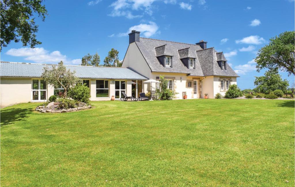 a house with a large lawn in front of it at Stunning Home In Yvias With Sauna in Yvias
