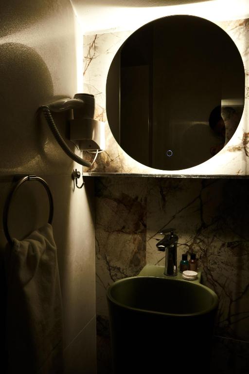 Koupelna v ubytování Amico Hotel