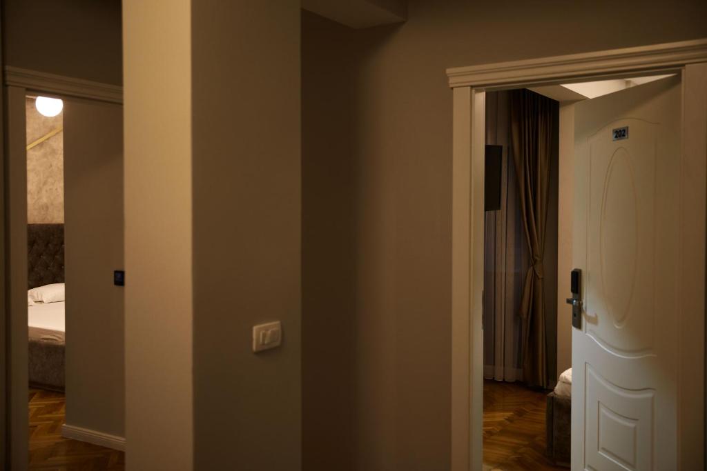 Postel nebo postele na pokoji v ubytování Amico Hotel