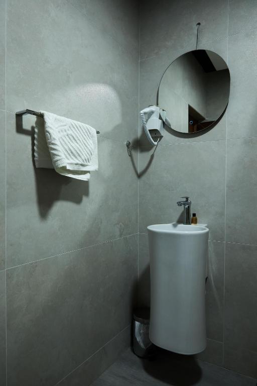Koupelna v ubytování Amico Hotel