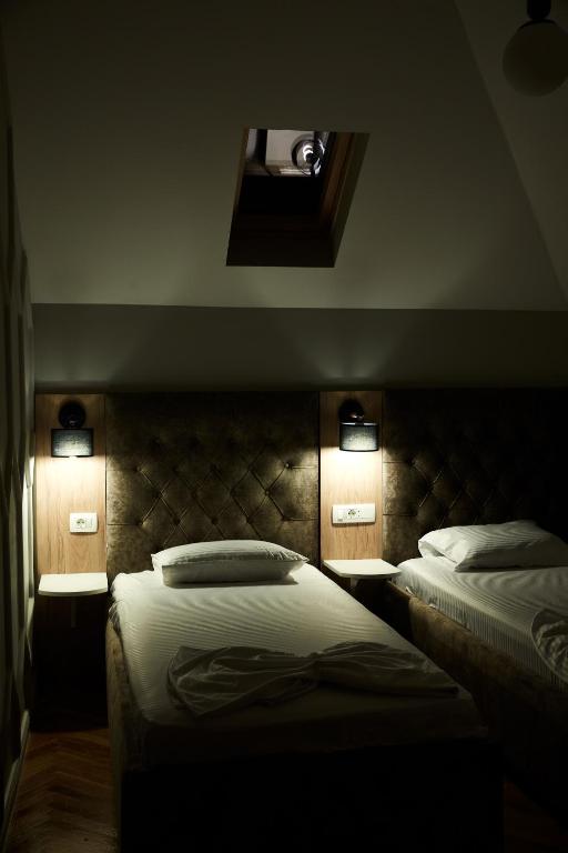 Postel nebo postele na pokoji v ubytování Amico Hotel